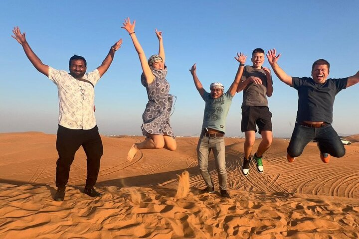 Jump into adventure as you explore the stunning desert landscape experiencing unforgettable moments with friends while sandboarding and camel riding in the heart of Dubai.